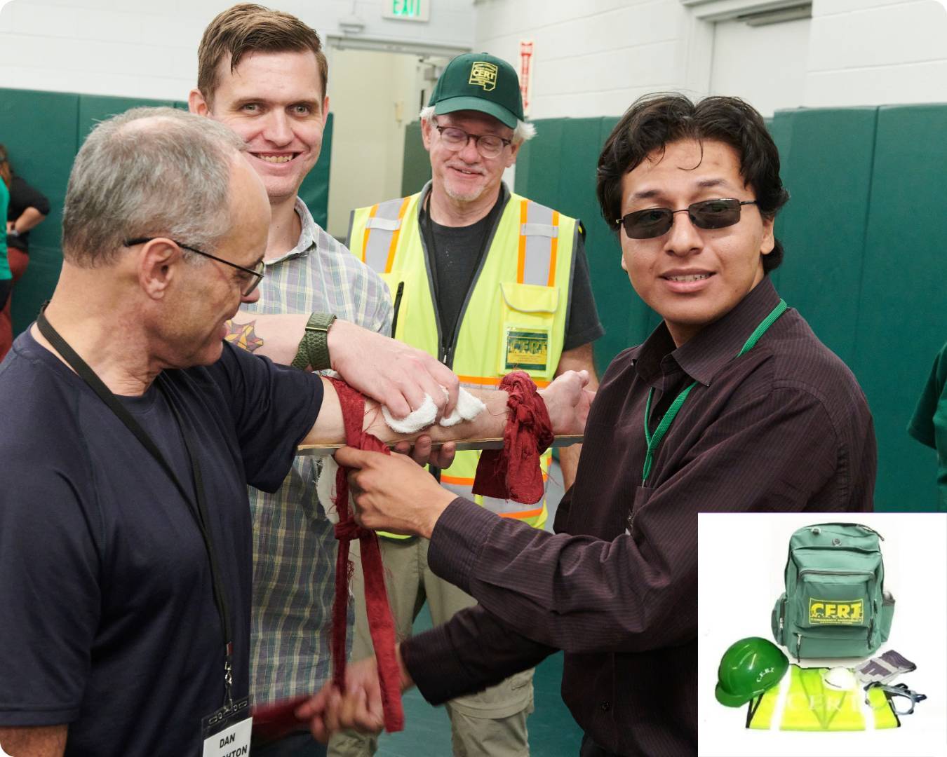 CERT medical training: group learning how to tie off arm with rubber bands in medical situation. 
